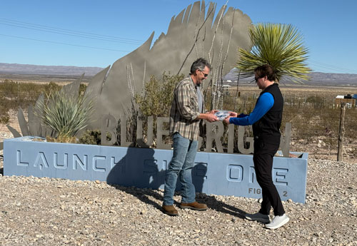 Dan Lauffer retrieves the experimental seedlings from Blue Origin